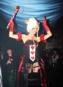 Queen of Hearts - she fire eats or mix & mingles on bouncy stilts!